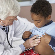 Image of doctor treating child